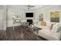 Bright living room with hardwood floors, fireplace, and large windows that let in lots of natural light at 158 Bryon Ln Ln, Acworth, GA 30102
