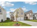 Well-maintained home with a two-car garage and beautifully landscaped front yard at 2023 Wyndham Pl, Conyers, GA 30013