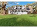 Charming home with a full front porch and well maintained yard at 935 Old Loganville Rd, Loganville, GA 30052
