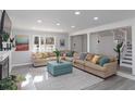 Bright, spacious living room with a large comfortable sofa and modern decor at 935 Old Loganville Rd, Loganville, GA 30052