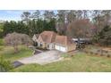 Well-maintained single-Gathering home with a two-car garage and large front lawn at 181 Pinehurst Ln, Marietta, GA 30068