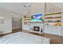 Bright living room showcasing a fireplace, built-in shelves, and hardwood flooring at 181 Pinehurst Ln, Marietta, GA 30068
