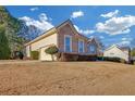 Well-maintained home with a side entry garage and lush lawn at 101 Fair Oaks Cir, Stockbridge, GA 30281