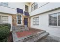 Apartment entrance with brick walkway and stairs leading to the front door at 2230 Cheshire Bridge Ne Rd # 116, Atlanta, GA 30324