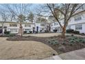 Charming courtyard with landscaping in front of apartments with painted doors at 2230 Cheshire Bridge Ne Rd # 116, Atlanta, GA 30324