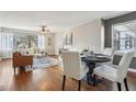 Inviting living area featuring hardwood floors, a dining area, and a large window at 2230 Cheshire Bridge Ne Rd # 116, Atlanta, GA 30324