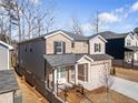A charming two-story home is beautifully designed with brick accents, siding, and a two-car garage at 1761 Dosk Ave, Lawrenceville, GA 30044