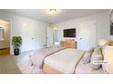 Bright main bedroom boasts carpeted floors and neutral walls, creating a tranquil retreat at 10839 Mallard Dr, Jonesboro, GA 30238