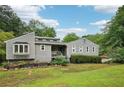 Beautiful exterior view with a well kept lawn and landscaped garden at 3087 Sanibel Sw Dr, Stone Mountain, GA 30087