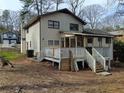 Expansive backyard with a large deck, perfect for outdoor entertaining and enjoying the serene surroundings at 457 Rockborough Ter, Stone Mountain, GA 30083