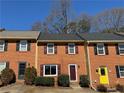 Well-maintained brick townhomes boasting uniform design and landscaping in a serene neighborhood at 1098 Westfield Se Trce, Smyrna, GA 30082