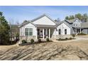 Inviting single-Gathering home with covered porch and beautifully landscaped front yard at 23 Knollwood Nw Way, Cartersville, GA 30121