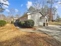 Charming single-story home with landscaped yard and inviting front porch, perfect for relaxing and enjoying the outdoors at 1950 S Inlet, Marietta, GA 30066