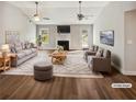 Spacious living room with vaulted ceilings, fireplace, wood floors, and natural light, perfect for entertaining guests at 1950 S Inlet, Marietta, GA 30066