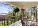 Relaxing porch view with wrought iron railing, seating, and a hanging fern, offering a tranquil outdoor space at 750 Clemont Ne Dr, Atlanta, GA 30306