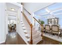 Bright staircase with carpeted steps, white risers, and a stunning view into the dining room at 450 Congress Pkwy, Lawrenceville, GA 30044