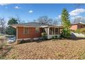 Brick home's backyard featuring a screened in porch, perfect for relaxation at 853 Erin Sw Ave, Atlanta, GA 30310