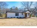 Newly renovated home with fresh exterior paint, and a inviting porch at 8176 Camp St, Douglasville, GA 30134