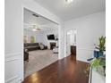 Open-concept living room with a fireplace, carpet flooring, and view to a half bathroom at 1227 Clear Stream Rdg, Auburn, GA 30011