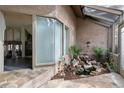 Bright sunroom featuring a small waterfall and seamless access to indoor living space at 870 Waddington Ct, Atlanta, GA 30350