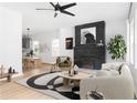 Inviting living room with a cozy atmosphere, complemented by stylish decor and a view into the dining area at 994 Byron Sw Dr, Atlanta, GA 30310