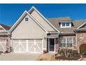 Charming home with a two-car garage, stone accents, and a welcoming front door at 312 Overview Dr, Canton, GA 30114