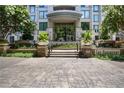 Inviting entrance to The Paramount, showcasing manicured landscaping and grand architectural design at 3445 Stratford Ne Rd # 2402, Atlanta, GA 30326