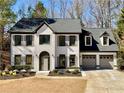 Beautiful two-story home with a brick and siding exterior, highlighted by a manicured lawn and attached two-car garage at 3850 Westwick Nw Way, Kennesaw, GA 30152