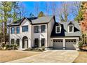 Attractive two-story home with a brick and siding front, featuring a well-kept lawn and an attached two-car garage at 3850 Westwick Nw Way, Kennesaw, GA 30152