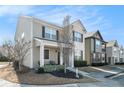 Attractive home displaying a blend of brick and siding, enhanced by a welcoming porch and tasteful landscaping at 855 Venture Sw Way, Atlanta, GA 30331