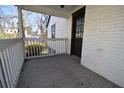 Side porch with white railing and plenty of room for relaxing at 232 Mathewson Sw Pl, Atlanta, GA 30314