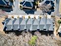 Overhead shot of townhome roofs showcasing uniform design and mature trees surrounding the neighborhood at 2349 Harshaw Ave, Lawrenceville, GA 30043