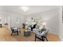 Bright and open living room with hardwood floors and modern neutral decor at 1428 Pinehurst Sw Dr, Atlanta, GA 30311