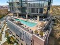 Rooftop pool with lounge chairs and seating areas offers a luxurious outdoor space with a view from a high-rise building at 788 W Marietta Nw St # 116, Atlanta, GA 30318