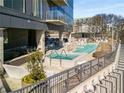 Rooftop pool and hot tub offer a relaxing amenity with lounge seating and city views in this luxury high-rise at 788 W Marietta Nw St # 116, Atlanta, GA 30318