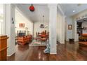 Spacious living room featuring hardwood floors, fireplace, columns, and natural light at 2348 Loraine Street Ne St, Atlanta, GA 30319