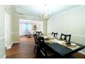 An open-concept dining area features seating for six with clear sightlines to living area at 2974 Michelle Lee Dr, Dacula, GA 30019