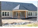 Spacious covered back porch with outdoor lighting and beautiful backyard views at 1883 Bennett Rdg, Snellville, GA 30078