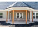 Inviting covered back porch with stylish columns, perfect for outdoor living at 1883 Bennett Rdg, Snellville, GA 30078