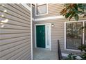 Stylish home featuring a charming green front door and neutral siding, enhancing curb appeal at 1307 Wynnes Ridge Se Cir, Marietta, GA 30067