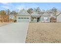 Charming single-Gathering home with an attached two-car garage and a long driveway at 2316 Ridge View Dr, Loganville, GA 30052