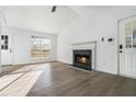 Cozy living room featuring hardwood floors, a fireplace and ample natural light at 347 Waits Sw Dr, Atlanta, GA 30331