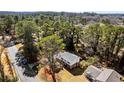 Aerial view showcasing the home nestled among mature trees in a tranquil neighborhood at 67 Blue Springs Sw Ct, Lilburn, GA 30047