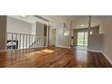 Open-concept living room with hardwood floors and natural light at 1325 Classic Ne Dr, Conyers, GA 30013