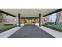 Inviting covered building entrance leads into the condo complex at 2965 Pharr Court South Nw # 316, Atlanta, GA 30305