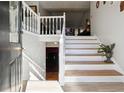 Inviting foyer with white staircase and light wood steps, offering a warm welcome into the home at 760 Josh Ln, Lawrenceville, GA 30045