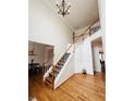Bright foyer featuring an open staircase, hardwood floors, and high ceilings at 2019 Chelton Se Way, Smyrna, GA 30080