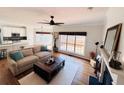 Open concept living room features a fireplace, hardwood floors and is open to the kitchen at 2019 Chelton Se Way, Smyrna, GA 30080