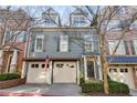 Exterior shot showcasing the home's detailed facade and attached two-car garage at 2421 Saint Davids Nw Sq, Kennesaw, GA 30152