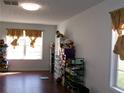 Bright living room with hardwood floors and natural light at 6809 Ridgewood Ln, Riverdale, GA 30296